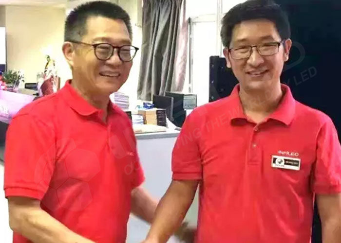 INFiLED CEO Michael Hao is shaking hands